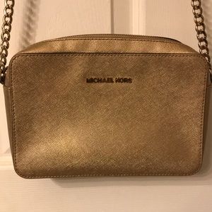 Michael Kors gold crossover bag